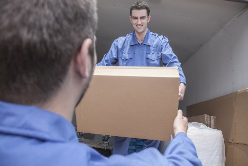 Removal team packing household items for a local move