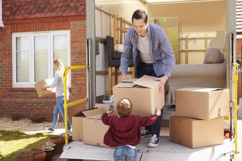 Man and van team loading furniture in North Finchley