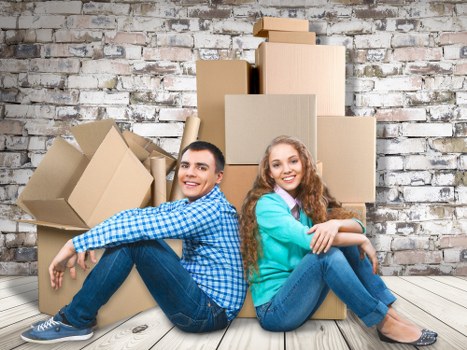 Commercial moving team transporting office items in North Finchley