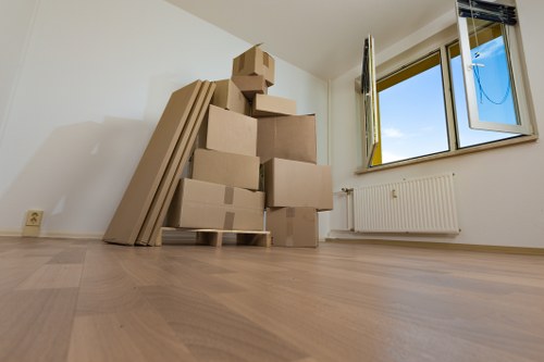 Packed office furniture and boxes ready for transport in North Finchley