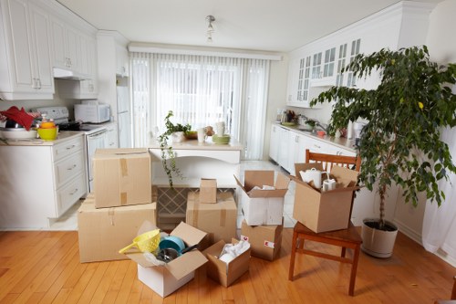 Careful wrapping and boxing of fragile household items during packing services
