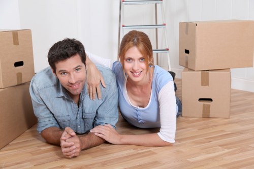 Professional moving truck loading boxes and furniture in North Finchley
