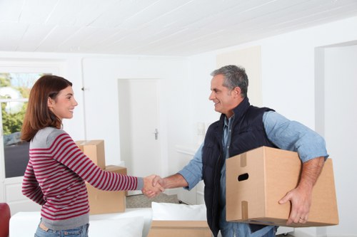 Professional movers handling furniture in North Finchley with care