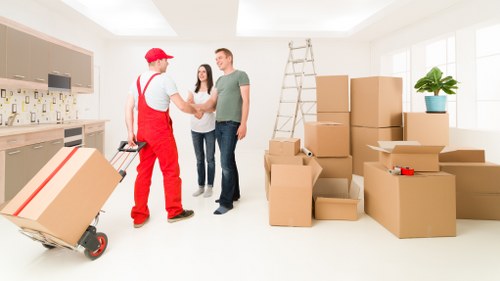 Local moving team organising boxes in North Finchley near residential streets