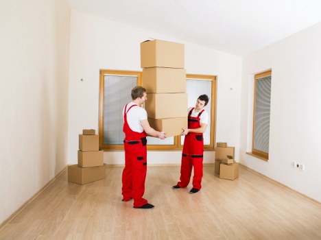 Packed office furniture and equipment ready for a business move